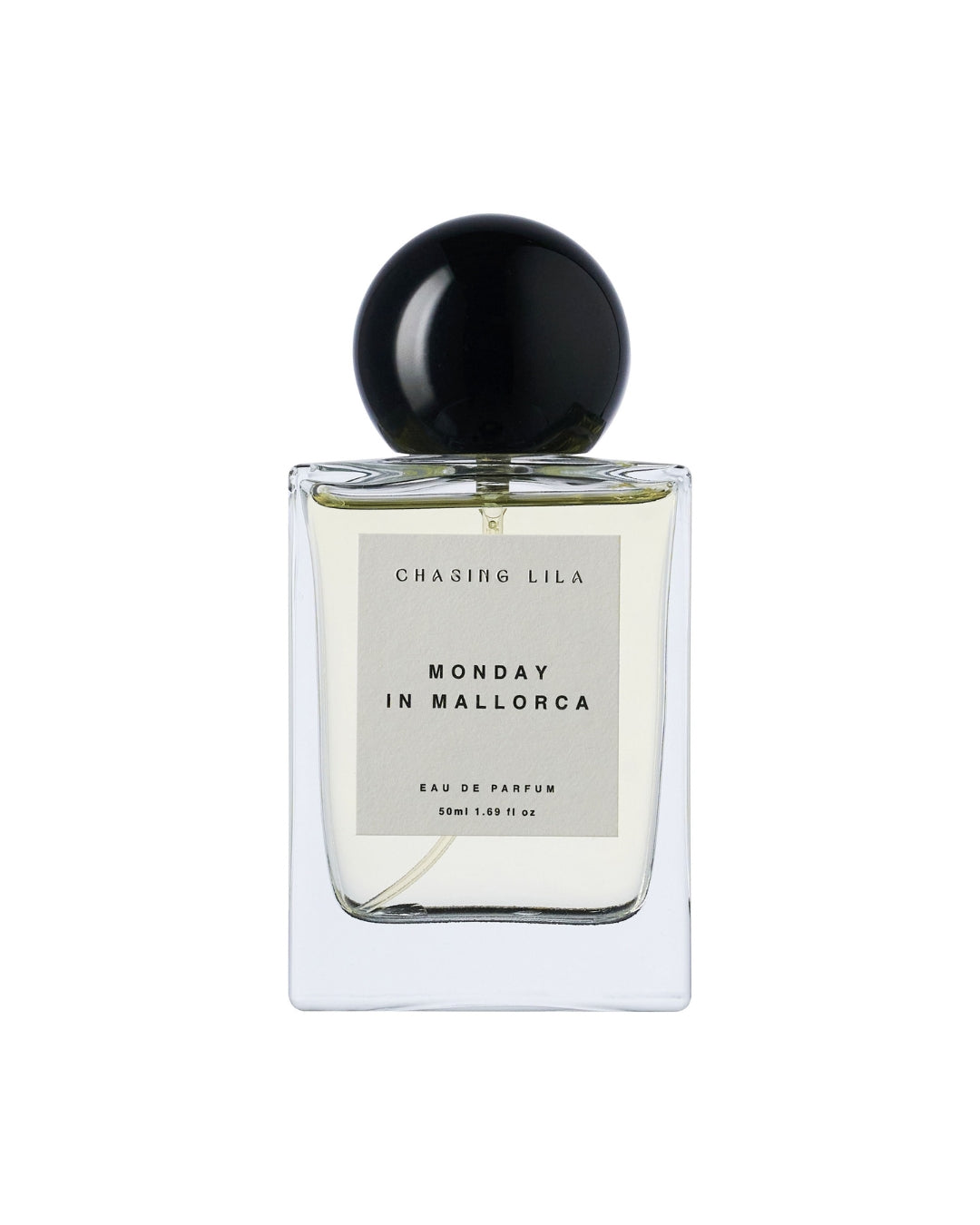 Perfume bottle labeled 'Monday in Mallorca' by Chasing Lila on a white background
